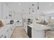 Open concept kitchen with island, stainless steel appliances, and pendant lighting at 22427 E Oriole Way, Queen Creek, AZ 85142