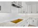 Modern kitchen with granite countertops, white cabinets, and stainless steel appliances at 22427 E Oriole Way, Queen Creek, AZ 85142