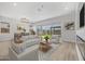 Open living space with fireplace, large windows and stylish furnishings at 22427 E Oriole Way, Queen Creek, AZ 85142