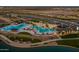 Community pool with expansive deck and surrounding landscaping at 22427 E Oriole Way, Queen Creek, AZ 85142