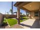 Covered patio overlooking a backyard with pergola at 22427 E Oriole Way, Queen Creek, AZ 85142