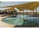 Resort-style pool with shaded areas and play features at 22427 E Oriole Way, Queen Creek, AZ 85142