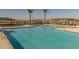 Community lap pool with plenty of lounge chairs at 22427 E Oriole Way, Queen Creek, AZ 85142