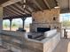 Cozy outdoor fireplace and seating area at 22427 E Oriole Way, Queen Creek, AZ 85142