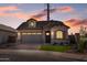 House exterior at dusk showcasing architectural details at 22427 E Oriole Way, Queen Creek, AZ 85142