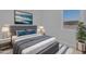 Bedroom with a gray bed, nightstands, and plenty of natural light at 22427 E Oriole Way, Queen Creek, AZ 85142