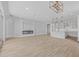Spacious living room with fireplace and kitchen island at 22427 E Oriole Way, Queen Creek, AZ 85142