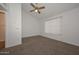 Spacious bedroom with carpeted floors and ceiling fan at 7977 W Wacker Rd # 174, Peoria, AZ 85381