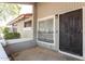 Exterior view of a condo with a cactus-design door at 4820 N 89Th Ave # 100, Phoenix, AZ 85037