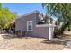 Exterior view of a condo with desert landscaping at 4820 N 89Th Ave # 100, Phoenix, AZ 85037