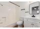 Updated bathroom with white vanity and bathtub at 4820 N 89Th Ave # 100, Phoenix, AZ 85037