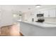 Modern kitchen with white cabinets and quartz countertops at 4820 N 89Th Ave # 100, Phoenix, AZ 85037