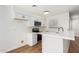 Modern kitchen with white cabinets and quartz countertops at 4820 N 89Th Ave # 100, Phoenix, AZ 85037