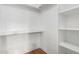 Bright white pantry with built-in shelves offering ample storage at 4820 N 89Th Ave # 100, Phoenix, AZ 85037
