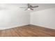 Bright bedroom with wood-look floors and ceiling fan at 4820 N 89Th Ave # 100, Phoenix, AZ 85037