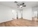 Bright bedroom with wood-look floors and mirrored walls at 4820 N 89Th Ave # 100, Phoenix, AZ 85037