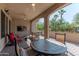Covered patio with seating area, ceiling fan and views of the backyard at 16917 W Sheridan St, Goodyear, AZ 85395