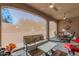 Covered patio with seating area and views of the backyard at 16917 W Sheridan St, Goodyear, AZ 85395