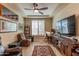 Cozy home office or den with a large TV and comfortable seating at 16917 W Sheridan St, Goodyear, AZ 85395