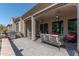 Extended patio with built-in grill and seating area at 16917 W Sheridan St, Goodyear, AZ 85395