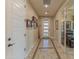 Tiled entryway with access to other rooms and a view of the living room at 16917 W Sheridan St, Goodyear, AZ 85395