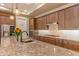 Modern kitchen with granite countertops and stainless steel appliances at 16917 W Sheridan St, Goodyear, AZ 85395