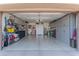 Organized garage with ample storage and overhead cabinets at 16917 W Sheridan St, Goodyear, AZ 85395