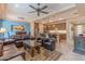 Open concept kitchen and living area with an island and breakfast bar at 16917 W Sheridan St, Goodyear, AZ 85395