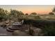 Landscaped backyard with water feature and golf course view at 22455 N 55Th St, Phoenix, AZ 85054