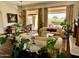 Spacious living room with hardwood floors, large windows, and formal dining area at 22455 N 55Th St, Phoenix, AZ 85054