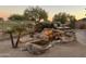 Stunning water feature with rock formations and lush landscaping at 22455 N 55Th St, Phoenix, AZ 85054
