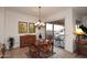 Cozy breakfast nook with a wooden table and chairs near sliding glass doors to a patio at 22455 N 55Th St, Phoenix, AZ 85054