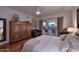 Spacious bedroom with a king-size bed, large closet, and access to a private patio at 22455 N 55Th St, Phoenix, AZ 85054
