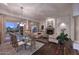 Elegant dining room featuring a glass-top table, hardwood floors, and access to the backyard at 22455 N 55Th St, Phoenix, AZ 85054