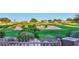 View of a green golf course from behind a fence at 22455 N 55Th St, Phoenix, AZ 85054