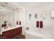 Spa-like bathroom featuring a soaking tub and double vanity at 22455 N 55Th St, Phoenix, AZ 85054