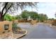 Gated community entrance with security access and landscaping at 22455 N 55Th St, Phoenix, AZ 85054