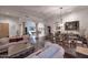 Spacious living room with hardwood floors, comfortable seating, and views to the game room at 22455 N 55Th St, Phoenix, AZ 85054