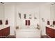 Large bathroom with a luxurious soaking tub, double vanities, and lots of natural light at 22455 N 55Th St, Phoenix, AZ 85054
