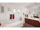 Elegant bathroom with soaking tub, double vanity, and large mirror at 22455 N 55Th St, Phoenix, AZ 85054