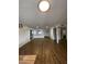 Open living room with kitchen view and wood flooring at 2814 N 55Th Ave, Phoenix, AZ 85035