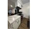 Kitchen with white cabinets, marble countertops, and stainless steel appliances at 2814 N 55Th Ave, Phoenix, AZ 85035