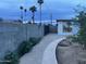 Backyard walkway leading to a studio and fence at 2814 N 55Th Ave, Phoenix, AZ 85035