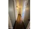 Clean hallway with light walls and wood-look flooring at 2814 N 55Th Ave, Phoenix, AZ 85035