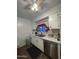 Kitchen with white cabinets, marble countertops, and stainless steel appliances at 2814 N 55Th Ave, Phoenix, AZ 85035