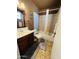 Bathroom with shower/tub combo and wood vanity at 2814 N 55Th Ave, Phoenix, AZ 85035