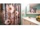 Clean bathroom with floral shower curtain and vanity at 312 S Emerald Dr, Apache Junction, AZ 85119
