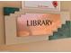 Image of Library room sign with teal and copper accents at 312 S Emerald Dr, Apache Junction, AZ 85119