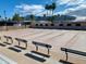 Multiple shuffleboard courts with seating at 312 S Emerald Dr, Apache Junction, AZ 85119