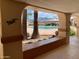 View of the community pool through an archway at 312 S Emerald Dr, Apache Junction, AZ 85119